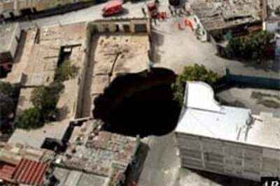 Guatemala sinkhole swallows homes