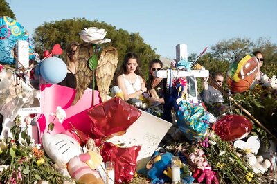 White Roses, Hundreds of Police as Florida Shooting School Reopens