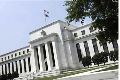 US Fed surprises, sticks to stimulus as it cuts growth outlook