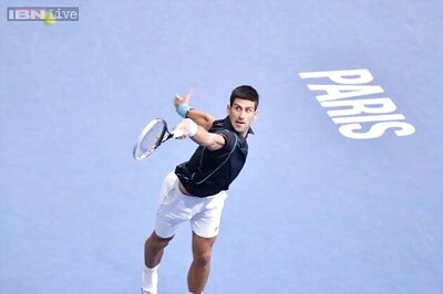 Novak Djokovic beats John Isner to reach Paris quarter-finals
