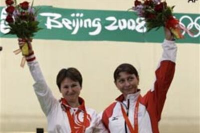 Russia-Georgia hug stands out for IOC chief Rogge