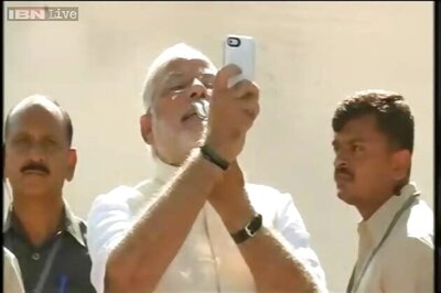 Narendra Modi clicks a selfie after casting his vote