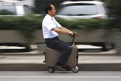 A battery-powered suitcase that doubles as a scooter
