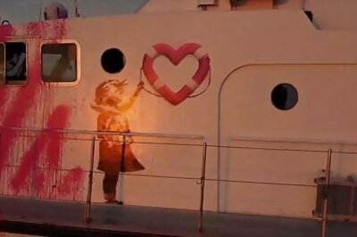 British Street Artist Banksy Funds Refugee Rescue Boat - The Guardian
