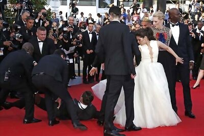 Man dives under actress America Ferrera's dress on Cannes red carpet