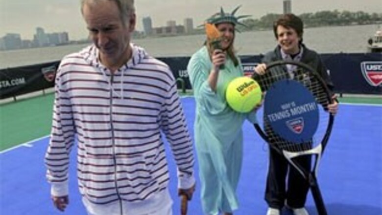 King, McEnroe play tennis on floating court