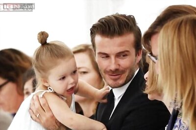 Harper Beckham shops hand-in-hand with dad David