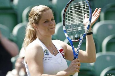 Clijsters wins in return to Wimbledon