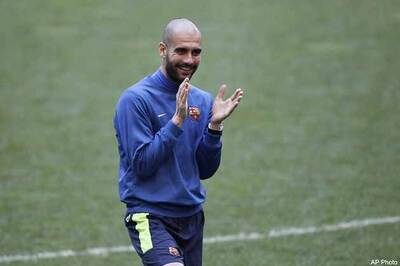 Treble winners Bayern unveil coach Guardiola
