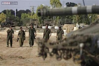 Gaza rockets land deep in Israel as it bombards Palestinian enclave