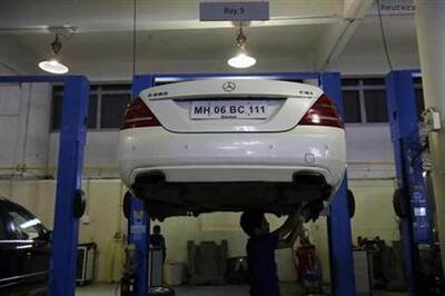 Luxury carmakers chase the young, female and frugal