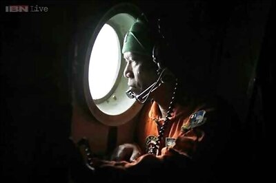 Teams searching for AirAsia flight QZ8501 spot smoke rising from an island in Java sea