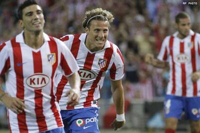 Forlan scores two as Atletico hammer Gijon