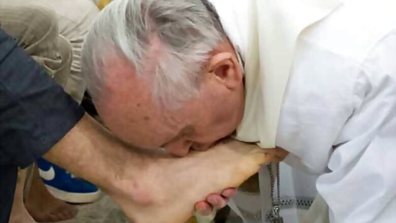 Pope washes women's feet in break with church law
