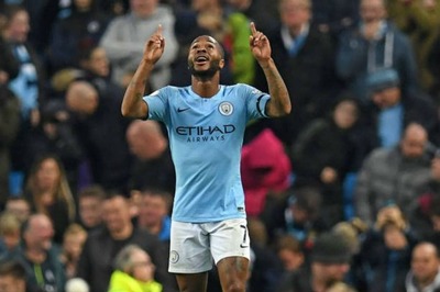 Manchester City Ease Past Huddersfield to Cut Liverpool's Lead
