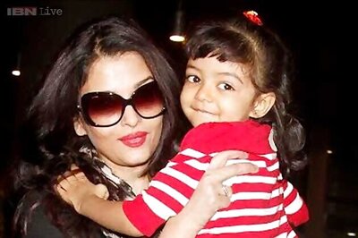 Getting used to the paparazzi? Aaradhya Bachchan smiles for the camera as she arrives in Mumbai with mum Aishwarya Rai