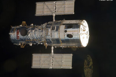 Astronauts installing new camera on Hubble