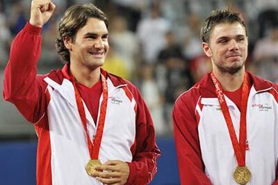 Hugs all round as Federer wins first Olympic gold