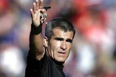 Referees get ready to roll the ball