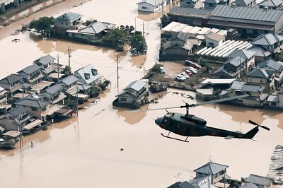 Japan Rescuers Go House to House as Flood Toll Hits 141