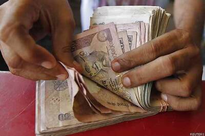 Rupee logs 1st rise in 3 days, up 12 paise to 62.56 vs dollar