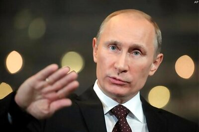 Putin talks tough but cools tensions over Ukraine