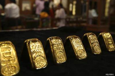 Gold falls, near 2-week low as dollar firms