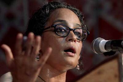 Arrest me for speaking for Naxals: Arundhati