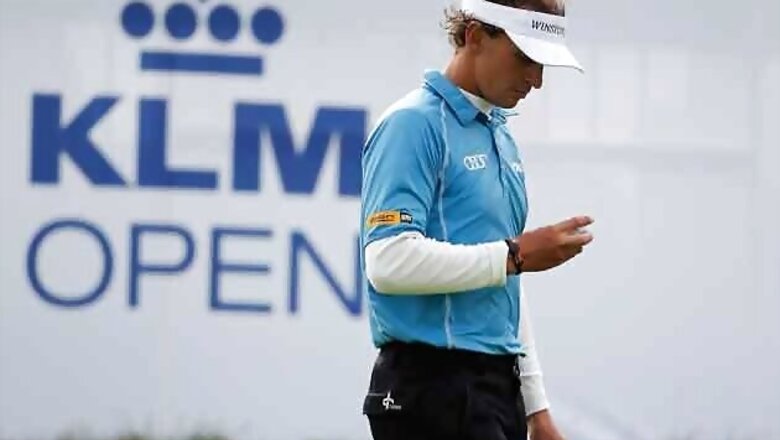 Luiten masters weather to take KLM Open lead