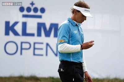 Luiten masters weather to take KLM Open lead