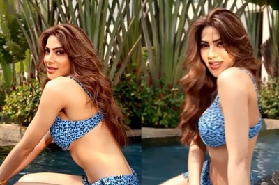 Sexy! Nikki Tamboli Flaunts Her Curves As She Lounges By The Pool In A Blue Bikini; Watch Hot Video