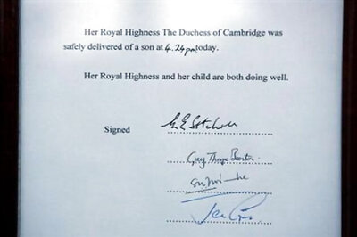 World awaits first glimpse of Britain's new prince