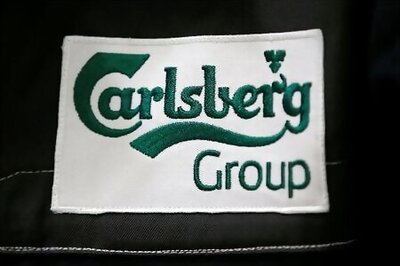 Carlsberg sees 2020 profit fall as lockdowns bite, suspends share buyback